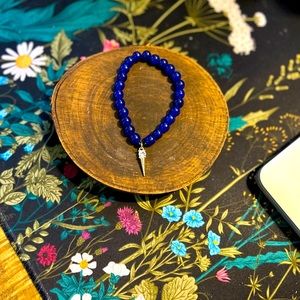 Blue jade bracelet with a beautiful dagger charm